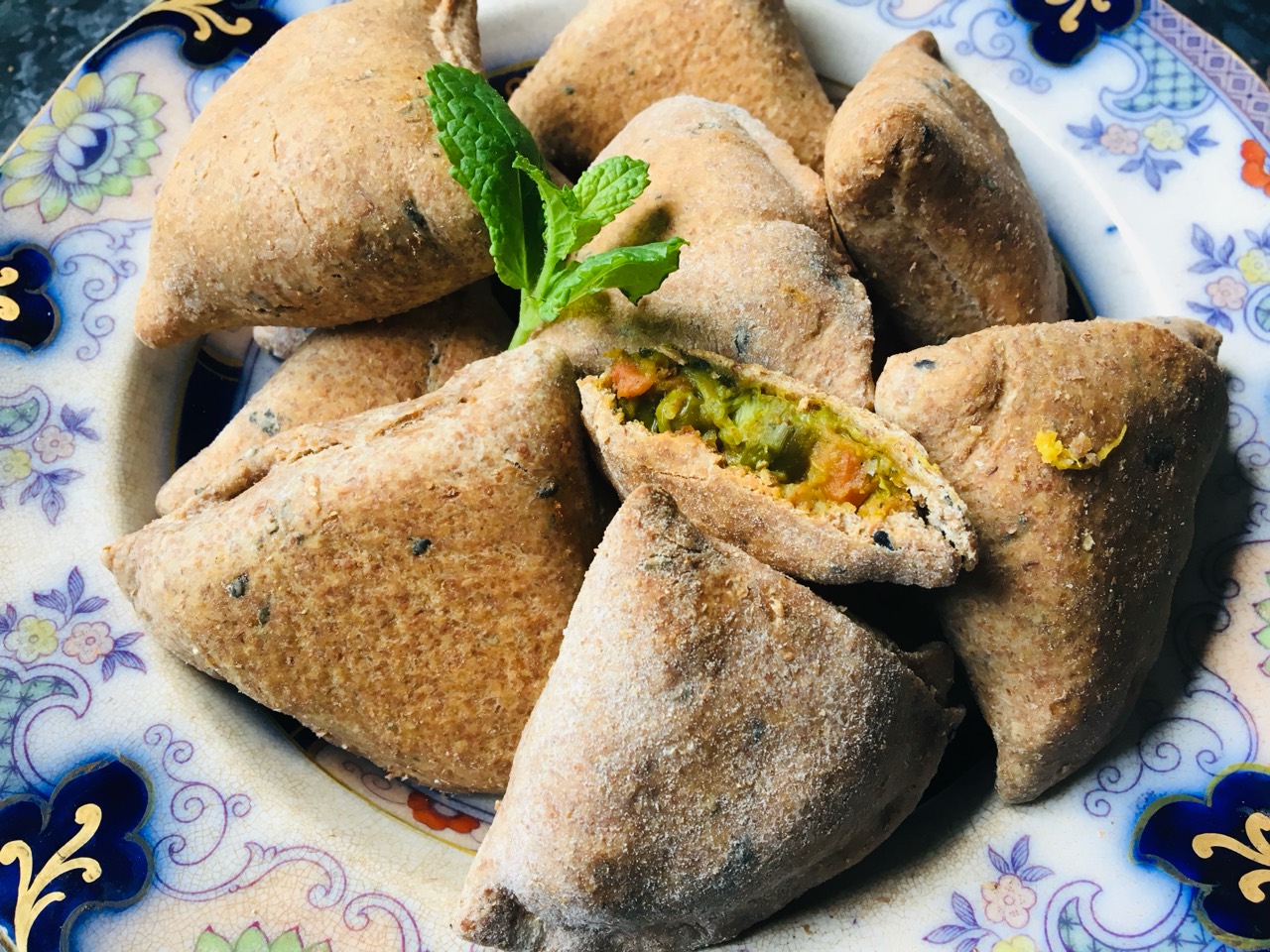 Easy healthy spelt samosas with a vegetable filling and fresh mint garnish.