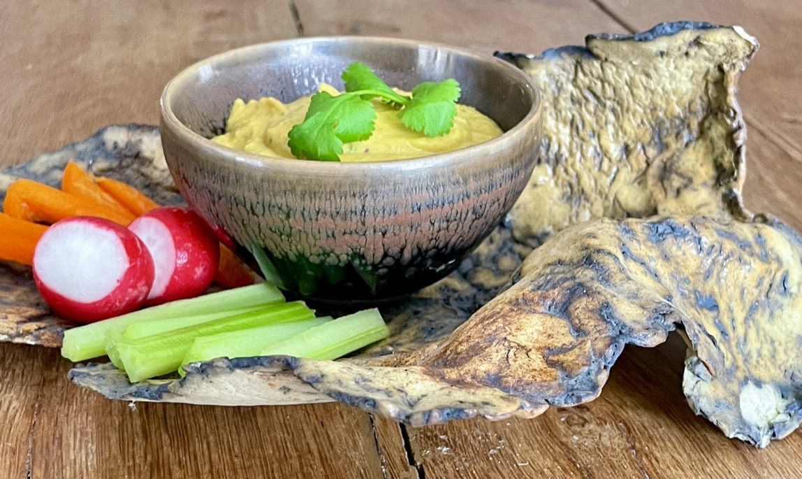 Lemony houmous served with crudités in handmade Wabi-sabi style bowls.